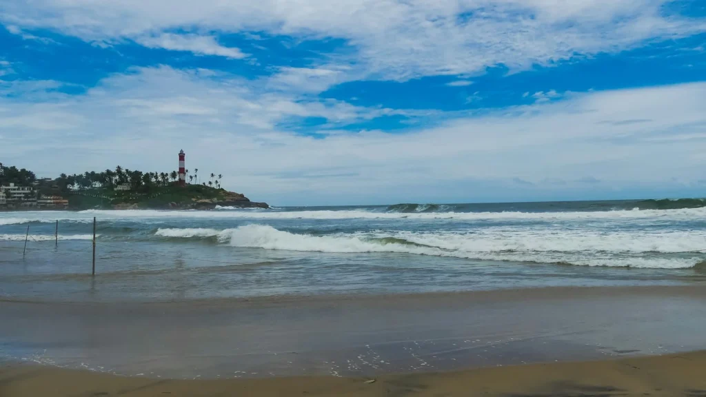Lighthouse Beach at Kovalam with the striped lighthouse on the headland