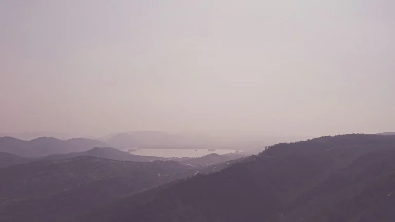 Green mountain hills under mist near Munnar lakes and viewpoints